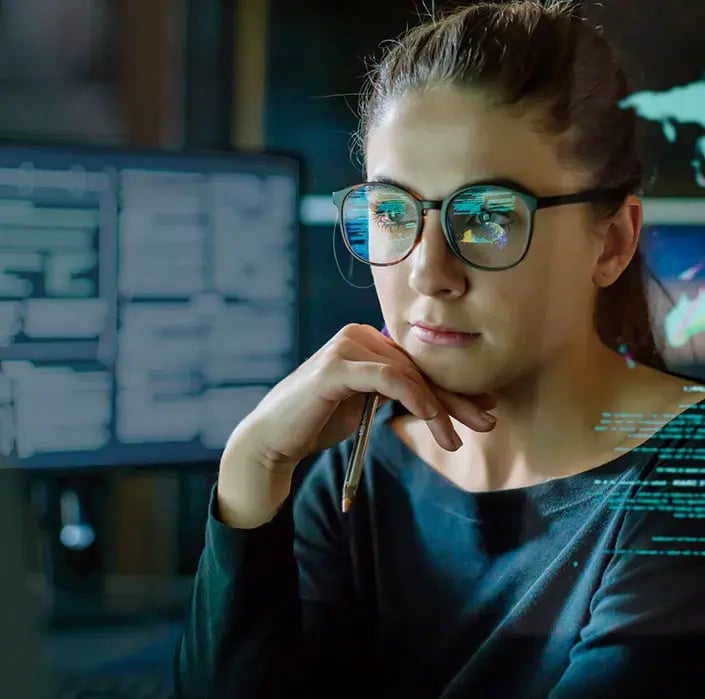 woman looking at monitors